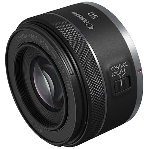 Canon RF 32mm f/1.8 macro lens with control ring and autofocus switch visible.