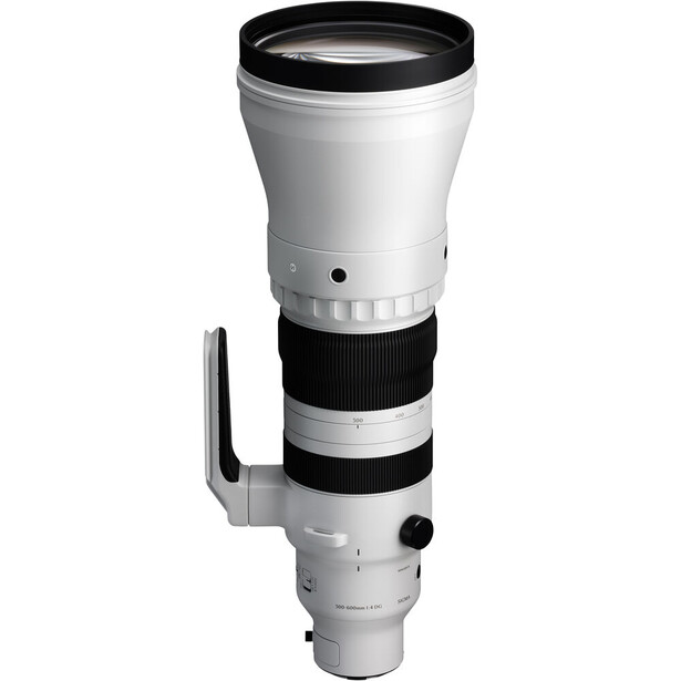White and black telephoto lens with tripod collar and focus ring against white background.