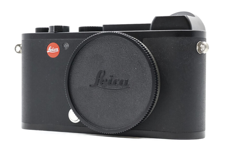 Leica Q2 compact digital camera body with lens cap, shown from front-left angle against white background.