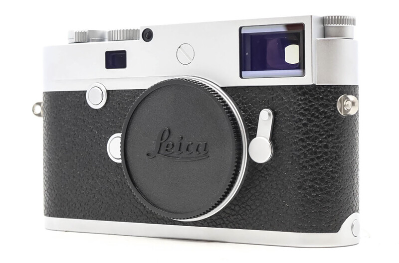 Leica M rangefinder camera with white top plate and black leather body against white background.