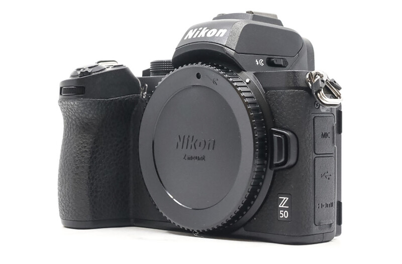 Nikon Z50 mirrorless camera body shown from front-left angle against white background.