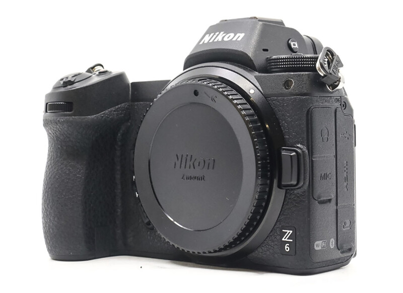 Nikon Z6 mirrorless camera body shown from three angles without lens attached.