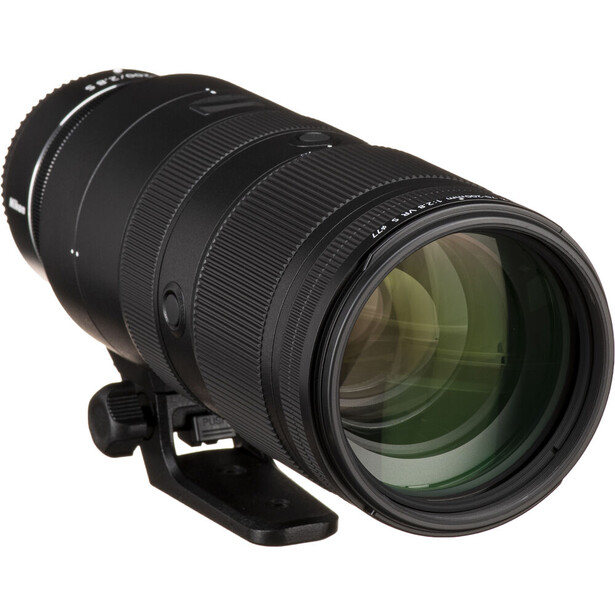 Black telephoto zoom lens with green-tinted glass elements visible through the front objective.