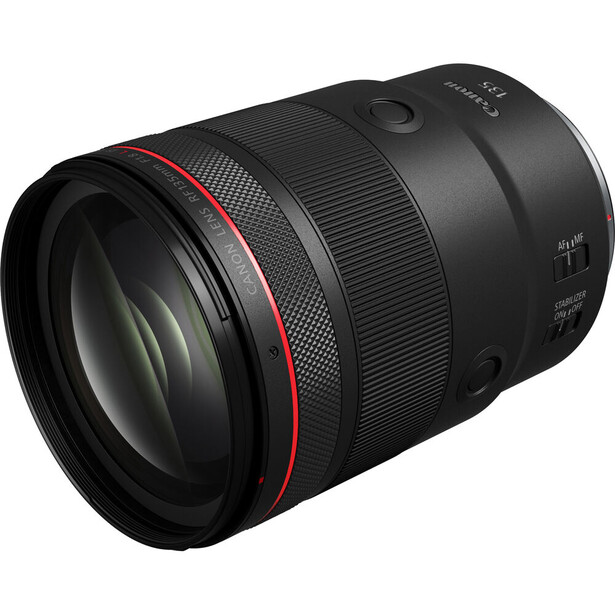 Canon RF-mount telephoto lens with red accent ring and textured grip sections.