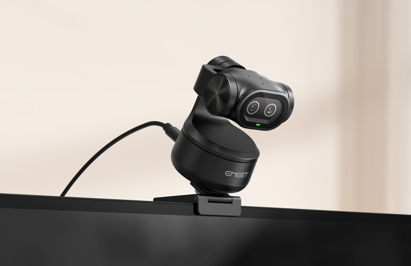 Black thermal imaging camera mounted on monitor with dual lens array and USB cable connection.