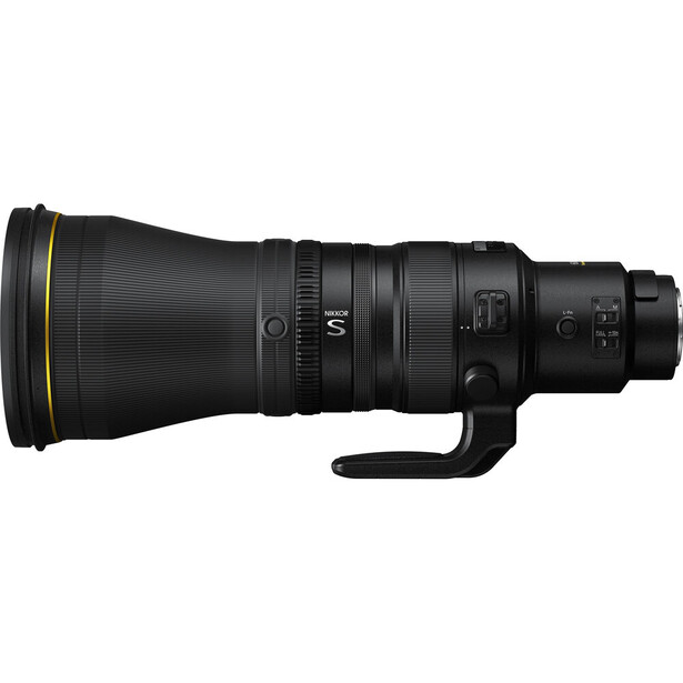 Black telephoto lens with gold trim and manual focus ring mounted on white background.