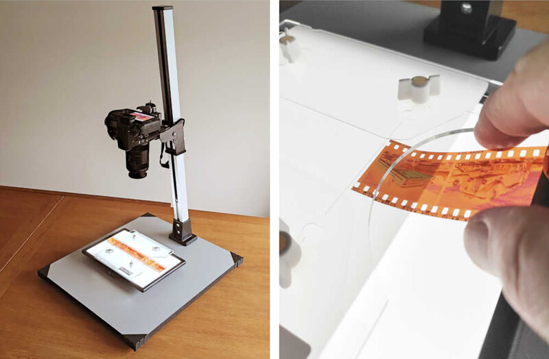 Film strip scanning setup with vertical camera mount and light box for digitizing 35mm film negatives.