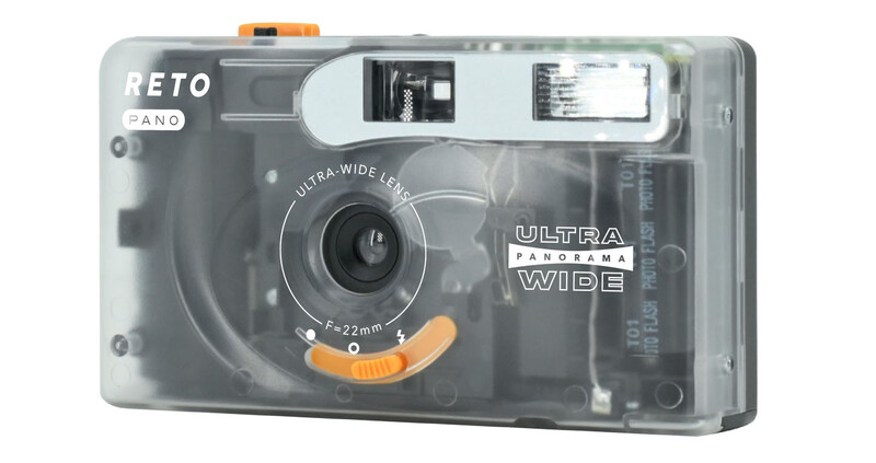 Reto Pano ultra-wide film camera with translucent gray body and orange accents.
