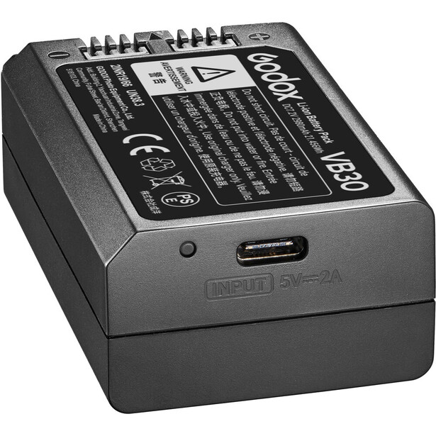 Professional battery charger with dual charging ports and status indicators on display panel.