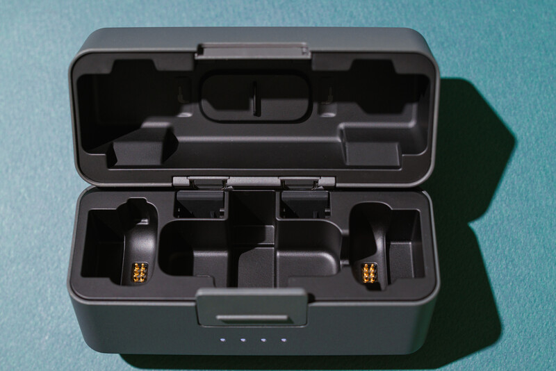 Open equipment case with custom foam interior and gold-plated connectors visible in compartments.