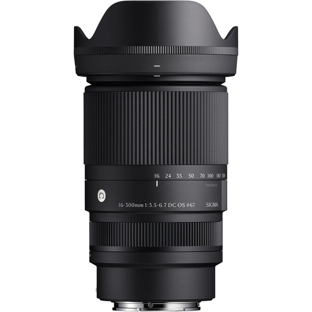 Sigma 18-300mm f/3.5-6.3 DC Macro OS HSM lens with hood attached against white background.