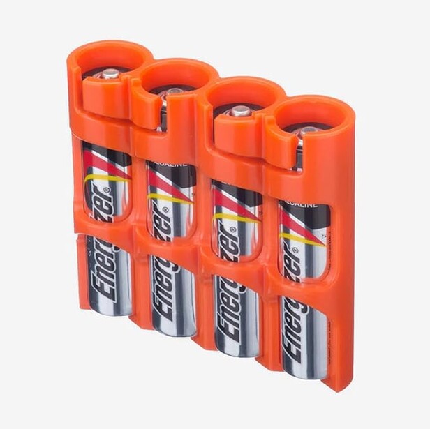 Four-pack battery holder with orange caps containing silver and black cylindrical batteries arranged in a 2x2 grid.