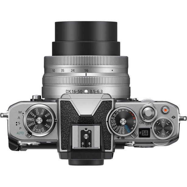 Top-down view of a rangefinder camera with interchangeable lens mounted on hot shoe.