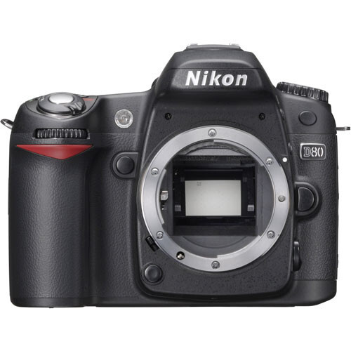Nikon D50 DSLR camera body with mirror open, showing sensor and internal mechanism.
