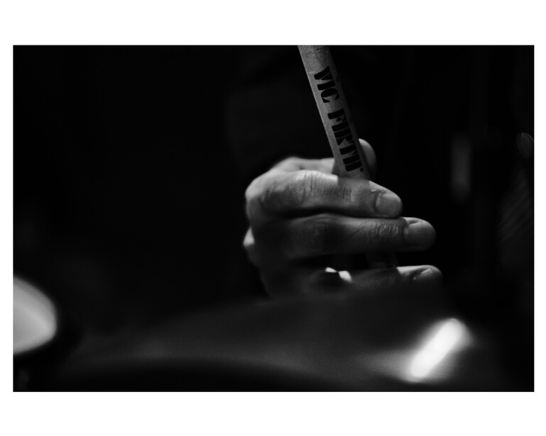 A close up of a drummer's hand