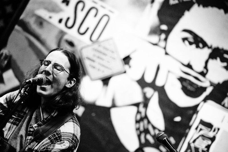 A singer/songwriter performing at a bar in New Yor