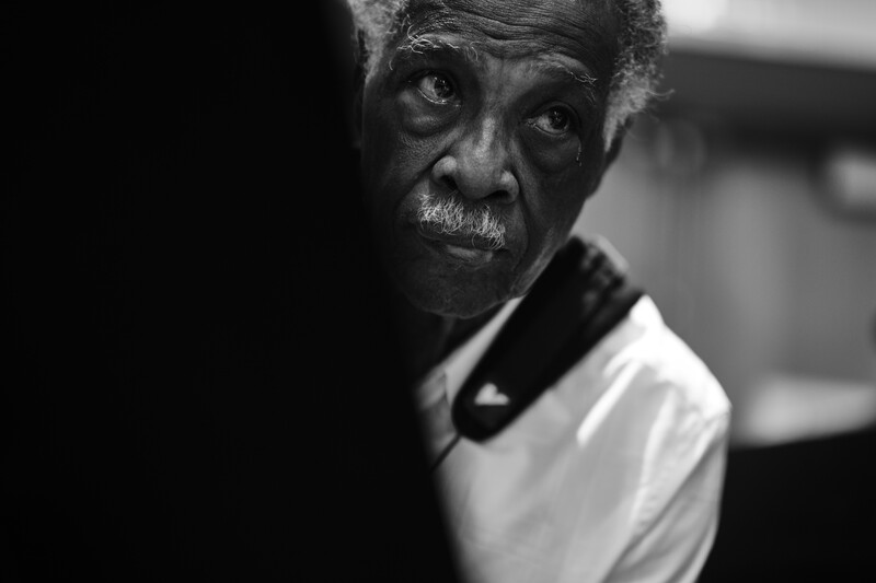 A saxophonist listening for the next tune.
