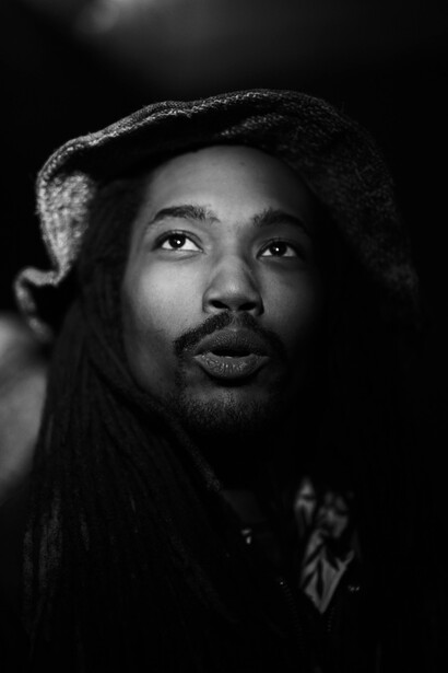 A musician captured after the gig using cell phone screen as a key light.