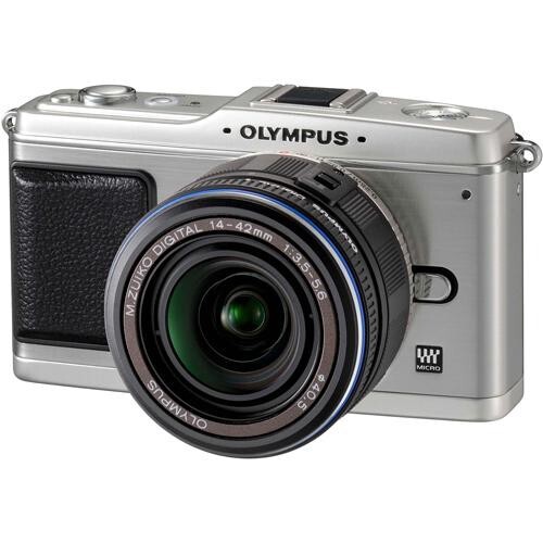 Olympus PEN E-P1 mirrorless camera with silver body and black grip, featuring a wide-angle zoom lens with green glass elements visible.