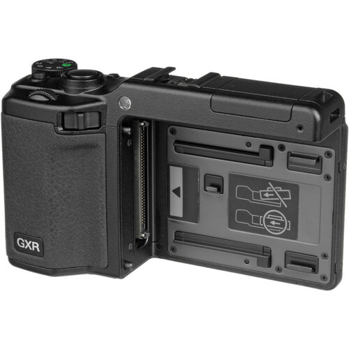 GXR camera body with modular lens and sensor cartridge system displayed open.