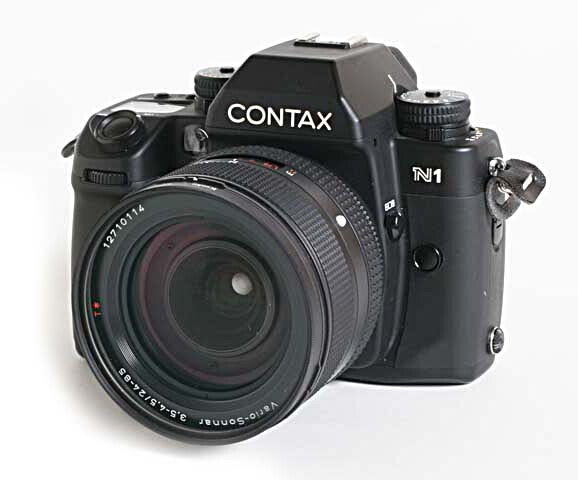 Contax RTS III film SLR camera with Carl Zeiss lens mounted, displayed against white background.