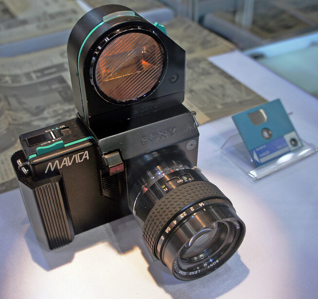 Vintage Kiev camera with attached telephoto lens and optical viewfinder mounted on top.