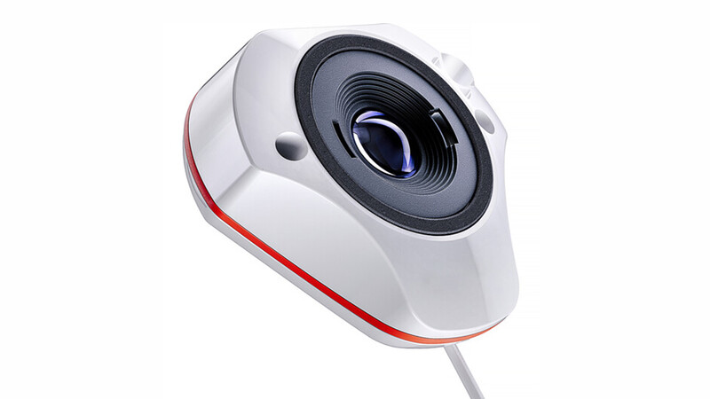 White and red webcam with dark lens viewed from an angled perspective.