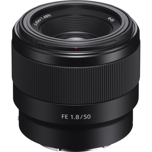 Sony FE 1.8/50mm prime lens with black barrel and ribbed focusing ring against white background.