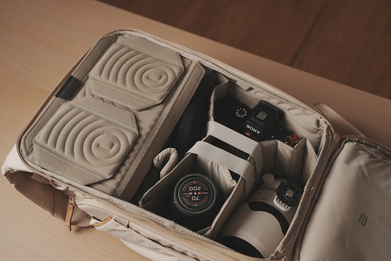 Photography gear packed in a custom foam-lined carrying case with organized compartments.