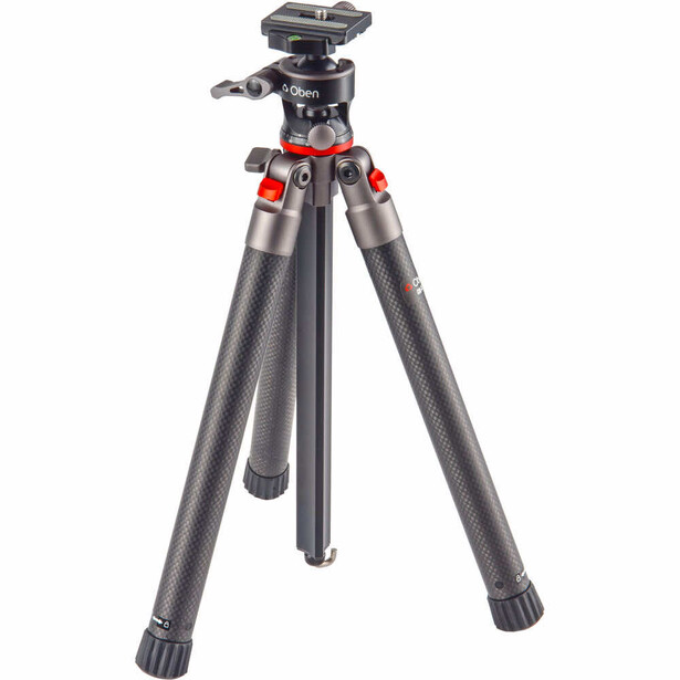 Professional tripod with carbon fiber legs, red accents, and ball head mount on white background.
