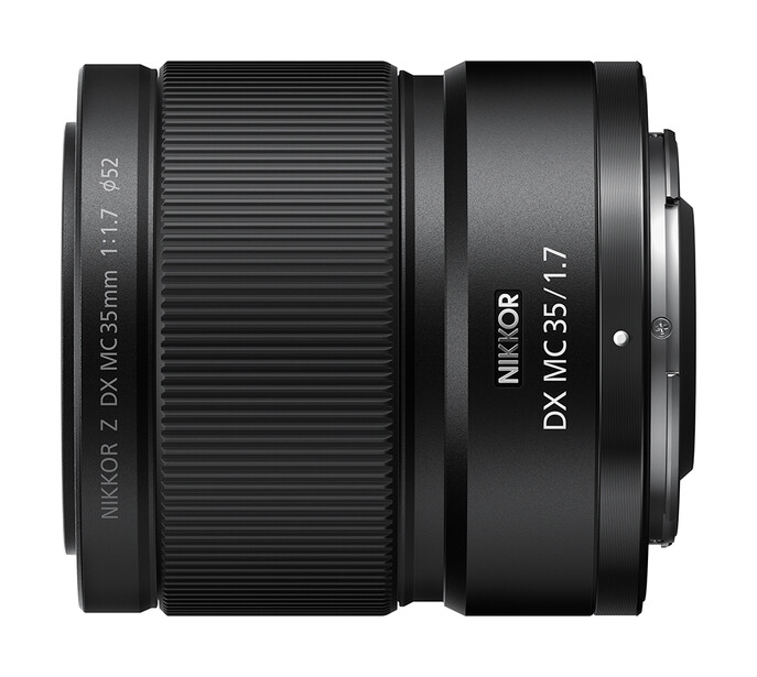 Two Nikon DX format lenses arranged side by side against a white background.