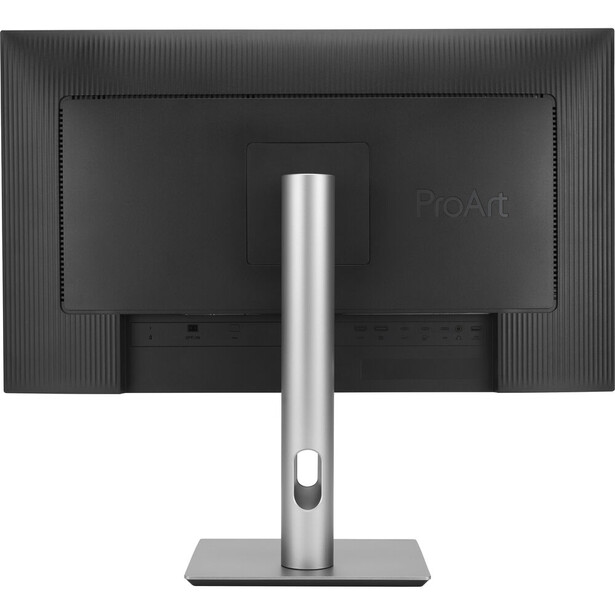 Rear view of a computer monitor with silver stand against dark background.