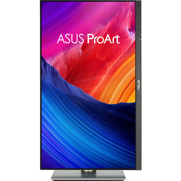 ASUS ProArt monitor displaying vibrant gradient wallpaper with purple, pink, red, orange, and blue colors.