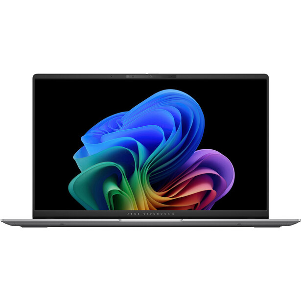 Laptop displaying vibrant abstract digital artwork with flowing ribbons of blue, green, yellow, and pink on black background.