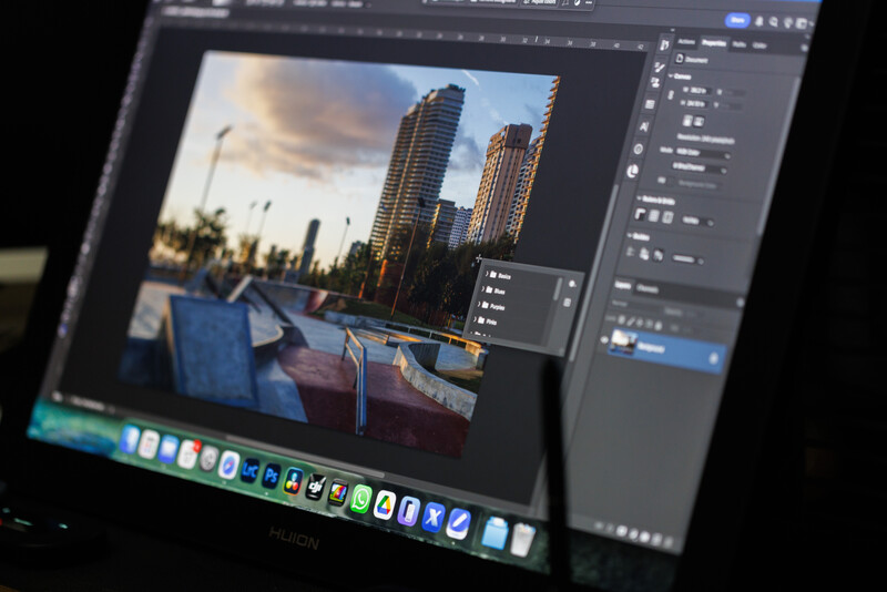 Screenshot of photo editing software showing an urban waterfront image with tall buildings during golden hour.