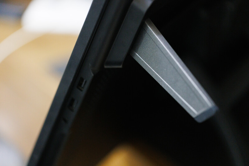 Close-up of a camera's hot shoe with a wireless trigger or remote receiver mounted on top.