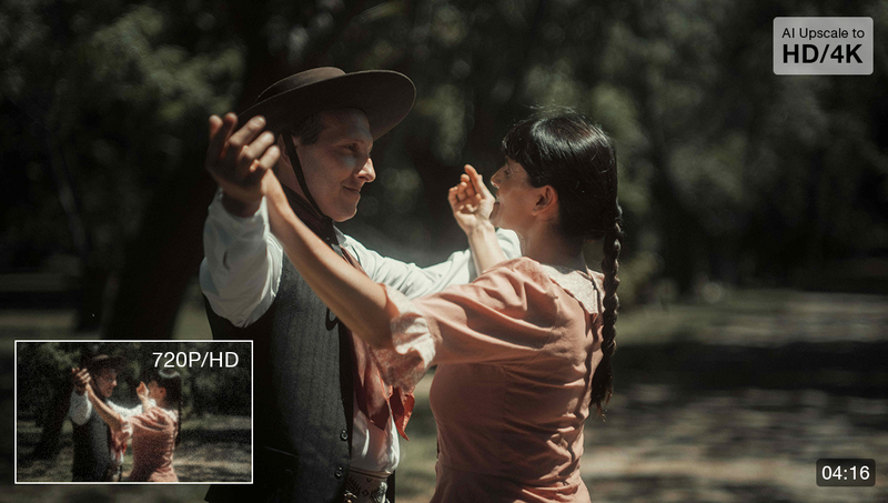Two people dancing outdoors in natural sunlight, with one wearing a cowboy hat and the other in a rust-colored shirt.