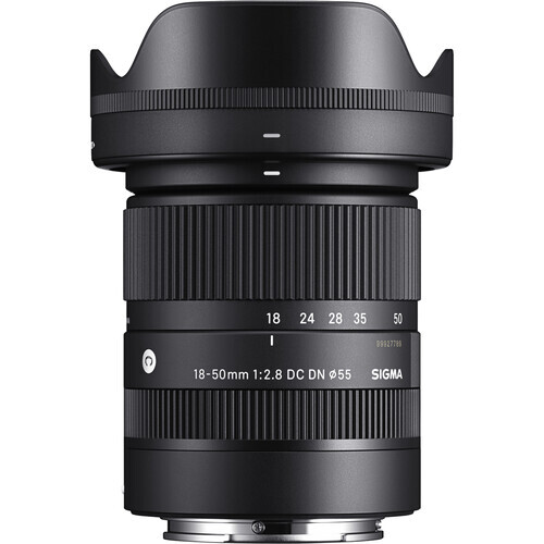 Sigma 18-50mm f/2.8 DC OS HSM lens with hood attached, shown against white background.