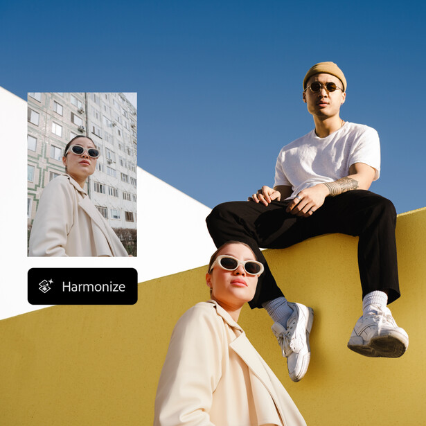 Three people wearing sunglasses pose on a geometric yellow structure against a blue sky.