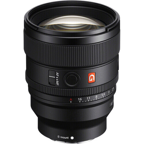 Sony E-mount telephoto zoom lens with orange AF/MF switch and distance scale markings on black background.