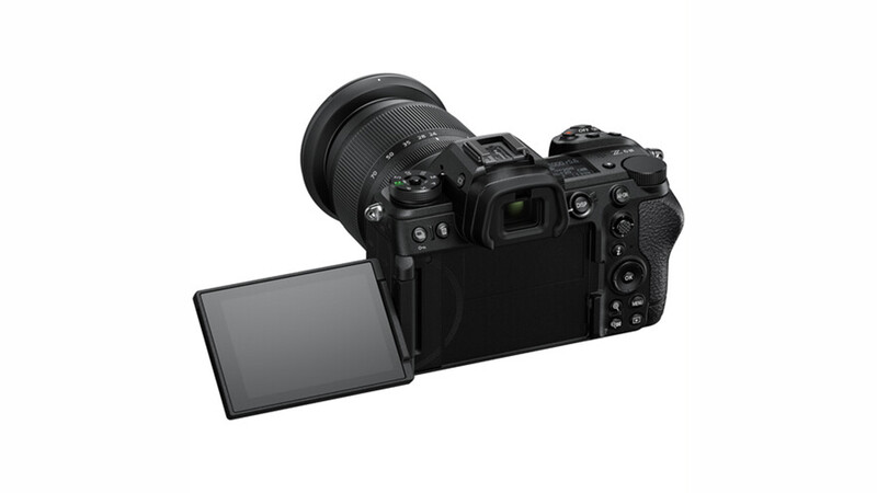 Professional mirrorless camera with attached zoom lens and articulating LCD screen extended.