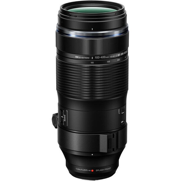 Black telephoto zoom lens with ribbed barrel and focus ring against white background.