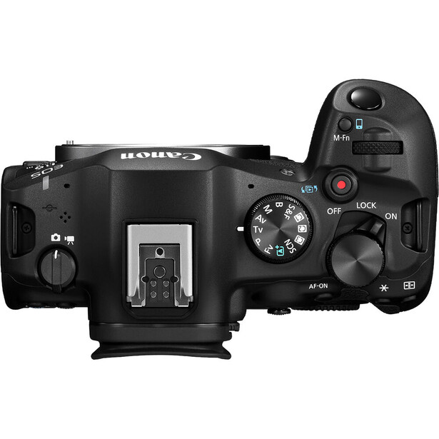 Top-down view of a Canon mirrorless camera body showing mode dial, hot shoe, and control buttons.
