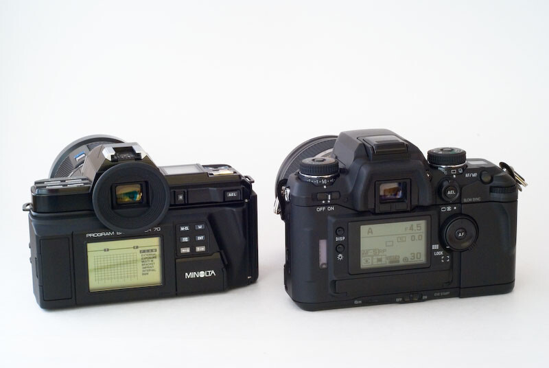 Two vintage film SLR cameras displayed side by side against a white background.
