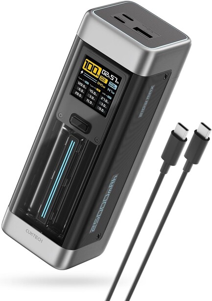 Portable battery charger with digital display and two USB-C cables included.