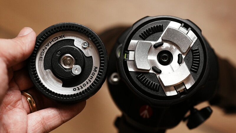 Two camera lens mounts displayed side by side, showing internal mechanical components and aperture blades in detail.