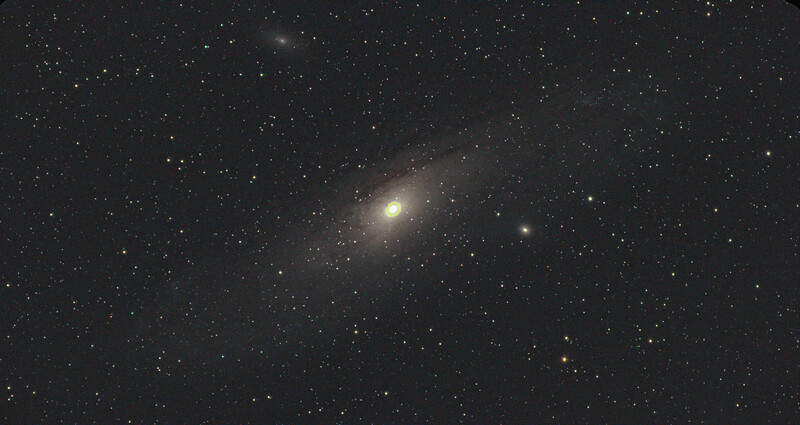 Spiral galaxy with bright central core against starfield.