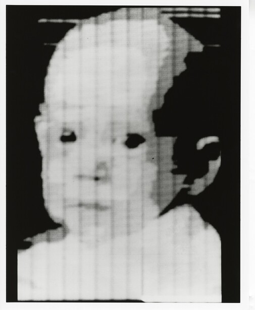 Black and white portrait of an infant's face with a grid overlay obscuring the image.