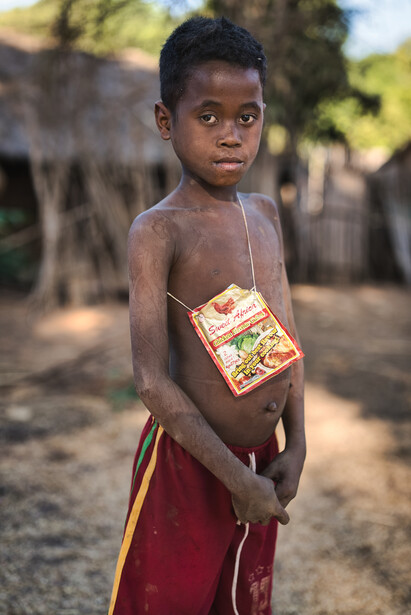 Boy with a homemade handbag from Madagascar