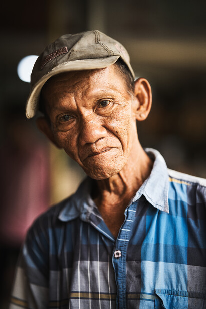 A portrait, close-up of the fruit seller.&nbsp;